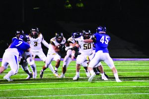 Jacob Link / The Advance-Titan--
Oshkosh running back Peter MacCudden (22) blazes past Whitewater’s defensive line in Friday night’s 17-3 loss against UWW at Perkins Stadium.