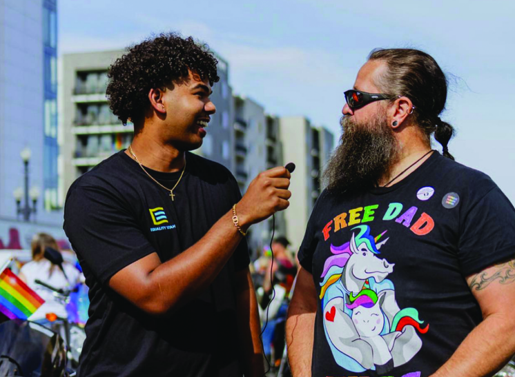 Photo courtesy of @blackmenaces on IG-- Sebastion Stewart-Johnson of Black Menaces interviews members of the LGBTQ+ community at a Utah pride parade.