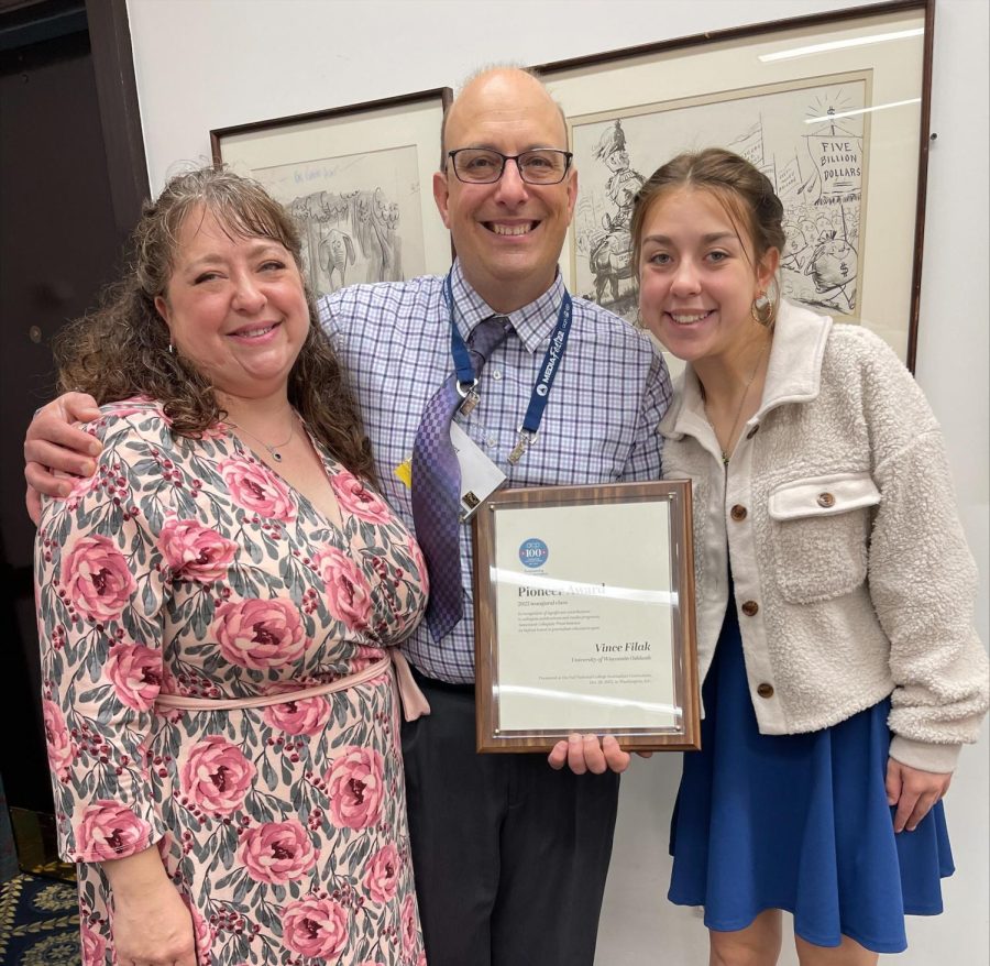 Photo courtesy of Vince Filak-- Dr. Filak poses next to family in celebration of his award.