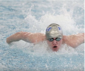 Chase Millam /Advance-Titan — Hayden Freeman swims the 100-yard butterfly in his senior year of high school.
