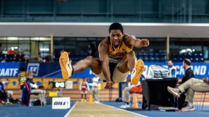 Courtesy of Vasha Hunt --Jonathan Wilburn competes in the triple jump, earning a program record 15.56 meters at nationals.