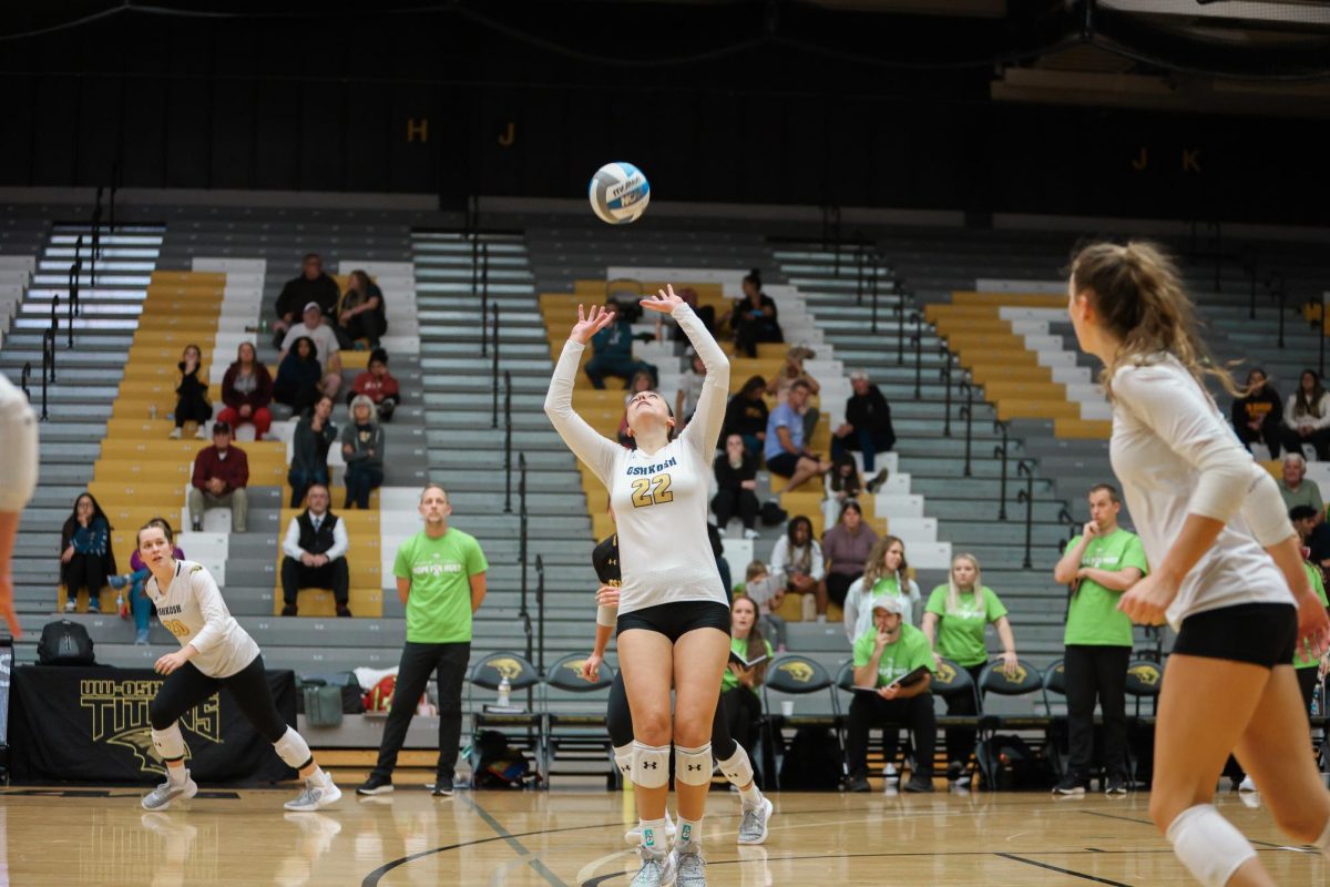 Morgan Feltz / Advance-Titan -- UWO setter Izzy Coon sets the ball over the net in Oshkosh’s 3-1 win over UW-Eau Claire Oct. 11 at the Kolf Sports Center.