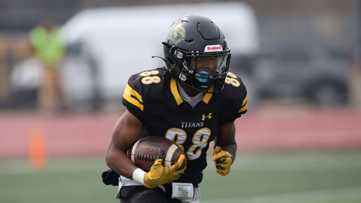 Courtesy of UWO Athletics -- UWO wide receiver Londyn Little runs with the ball in a game earlier this season. Little recorded 60 yards and two touchdowns on five receptions in the double-overtime win on Oct. 7. Littles two touchdowns against Stout were the  first in his career with the Titans.