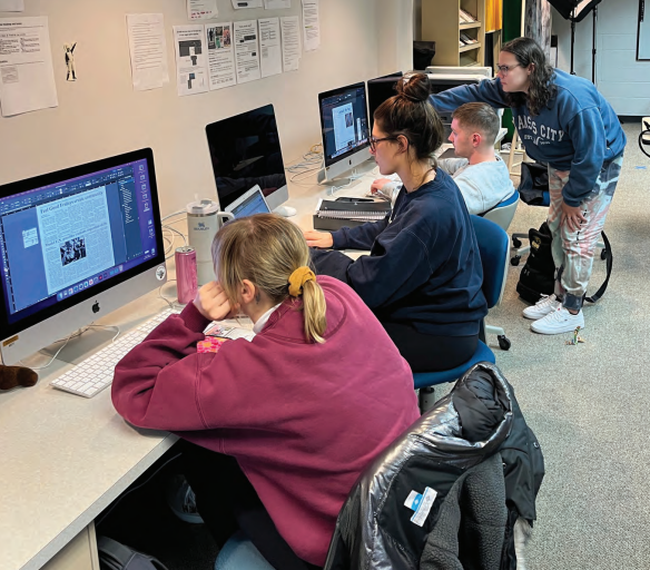 Owen Larsen / Advance-Titan - The Advance-Titan staff works on this week’s paper in their Reeve Memorial Union office.