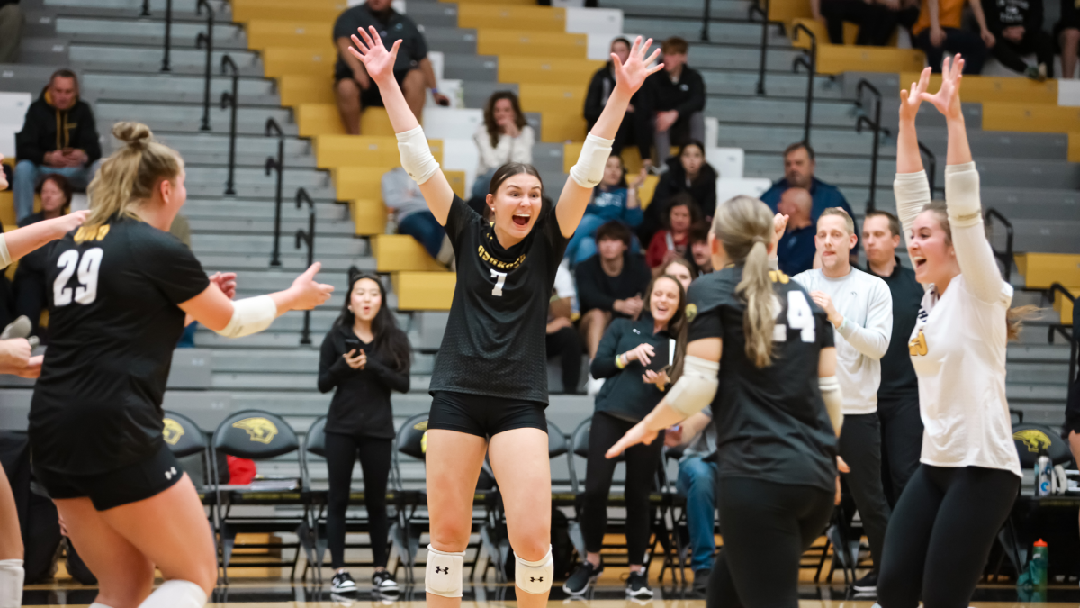 Courtesy of UWO Athletics -- Kalli Mau (7) celebrates after the match-winning point. Mau led the Titans with 20 assists as UWO returned to the WIAC title match for the first time since 2008.