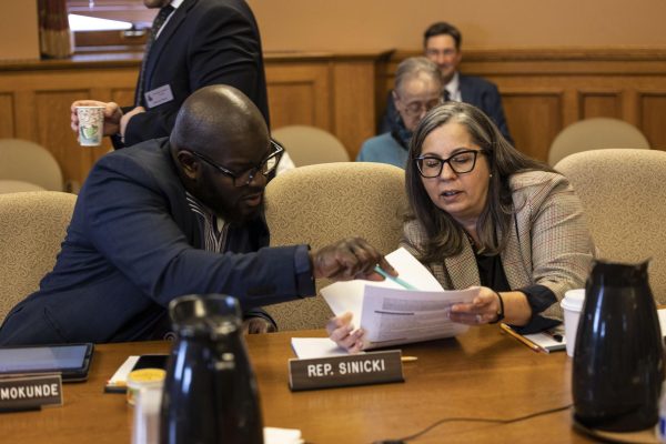 Courtesy of Lori Palmeri - Rep. Lori Palmeri looks over a document with Rep. Supreme Moore Omokunde. An Oshkosh resident since 2008, she was elected to the 54th Assembly District in 2022.