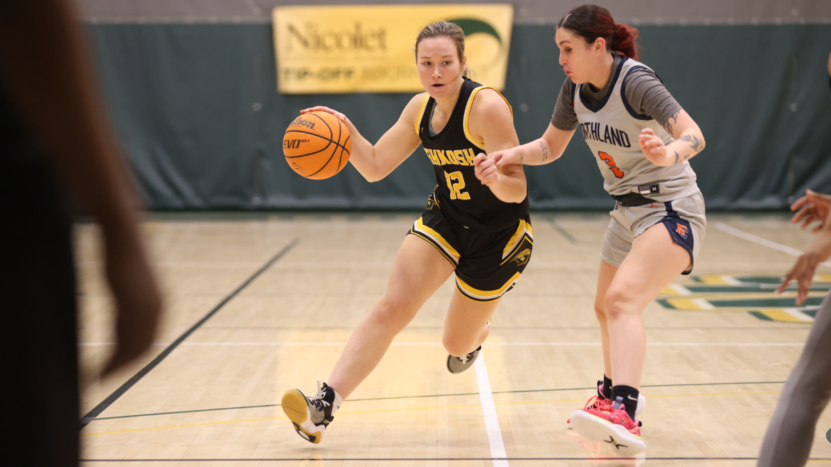 Courtesy of UWO Athletics -- UWOs Bridget Froehlke drives to the basket against a Northland University defender in a road game earlier this season. Froehlke scored 18 points off the bench against Washington University Dec. 2.