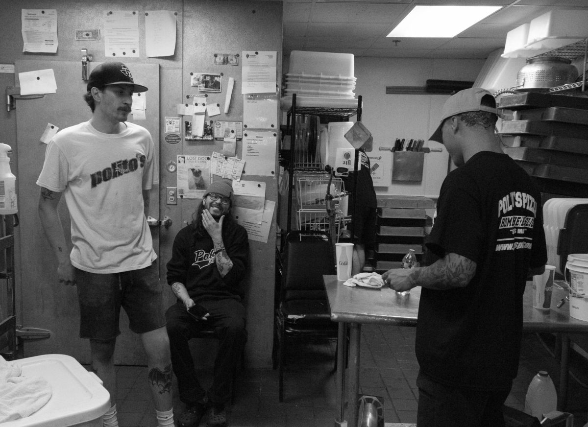Joseph Endres / Advance-Titan — Polito’s Pizza employees sit and chat in preparation for the dinner rush.