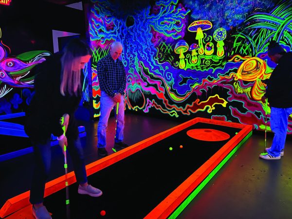 Advance-Titan File Photo 
A family enjoys a round of mini golf at Glow in the Park on Koeller 