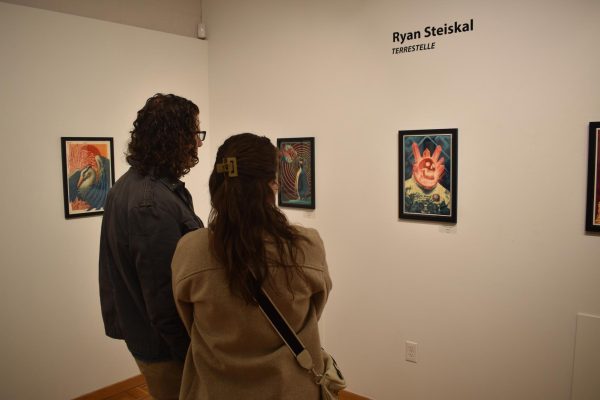 Kyiah Nelson / Advance-Titan
Many community members attended the art gallery reception to support UWO alumnus Ryan
Steiskal on April 5