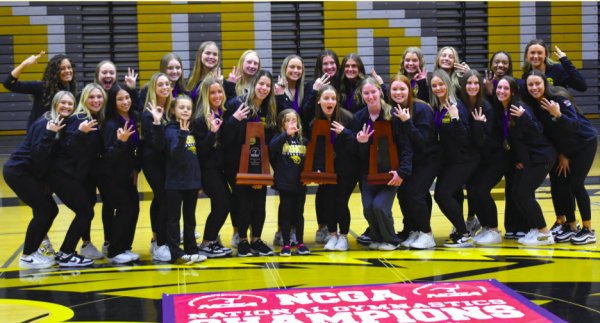 Jacob Link / Advance-Titan 
The UWO gymnastics team celebrates with national championship trophies from 2022, 2023 and 2024 at a welcome back ceremony April 2 at the Kolf Sports Center