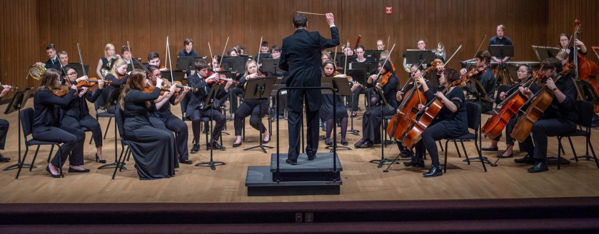 Courtesy of UW Oshkosh Flickr 
The Oshkosh Symphony Orchestra performs at a previous concert under the conduction of the director of orchestras, Dylan Thomas Chmura-Moore.