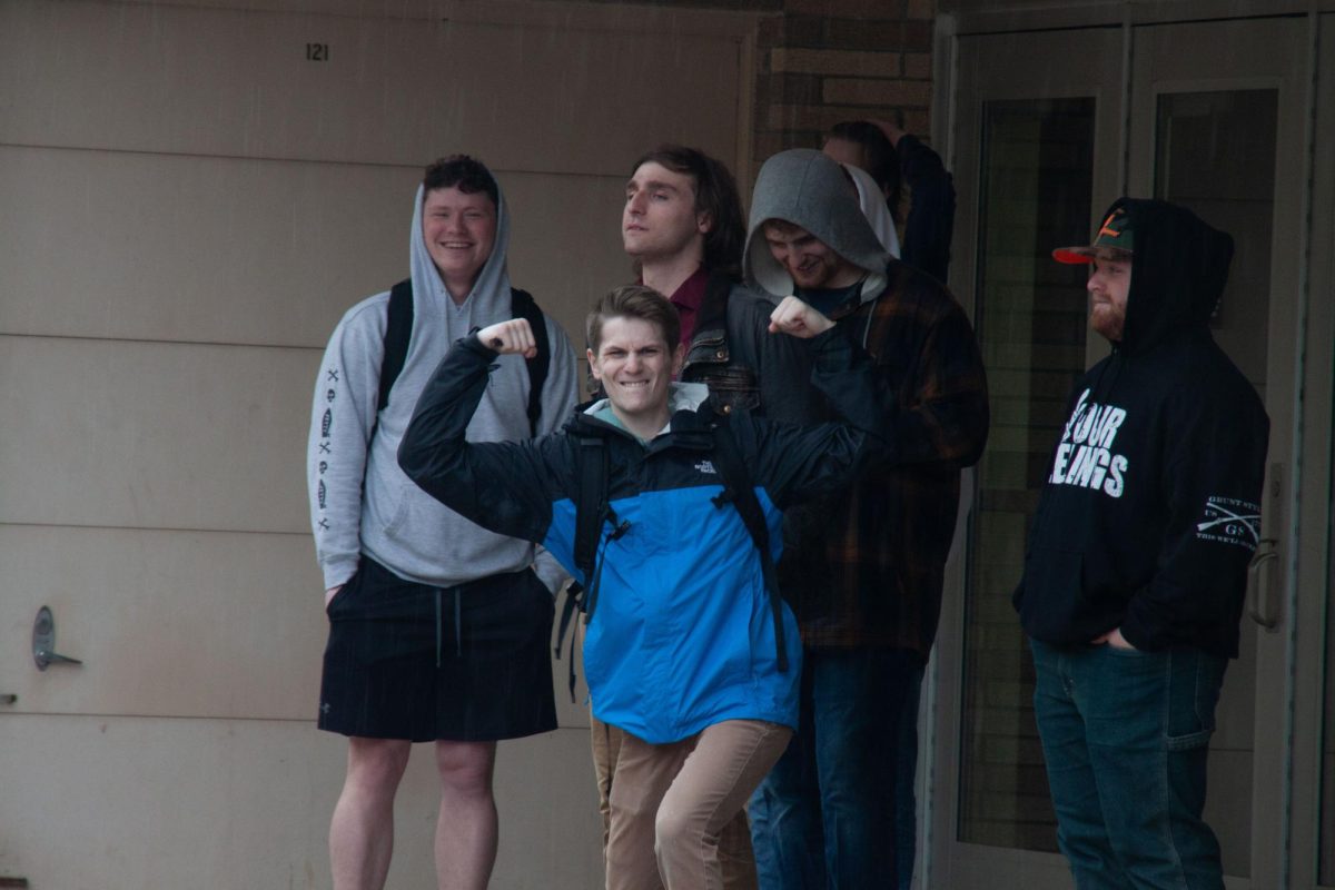 Counter protesters laughing and posing for the Advance-Titans photo editor Jessica Duch. 