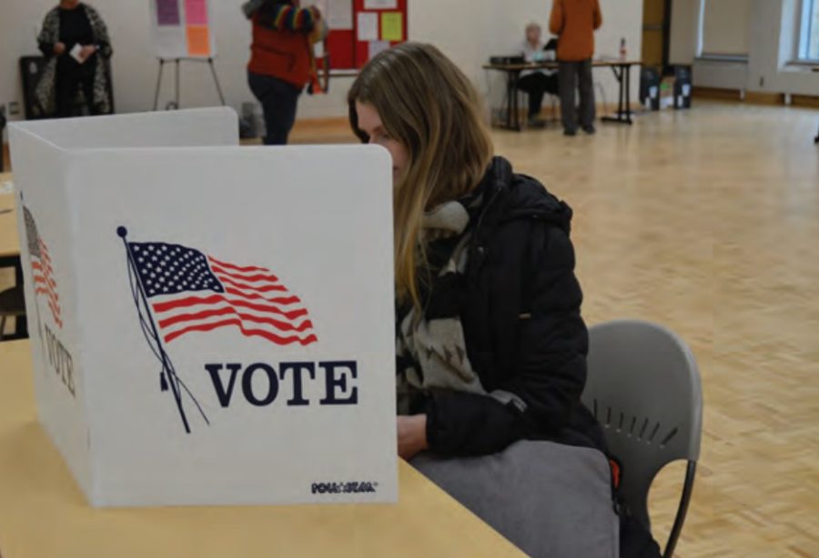 Advance-Titan File Photo – A student voting on campus a few years ago. Students can pick up a voting ID at Titan Central in Reeve Union. 