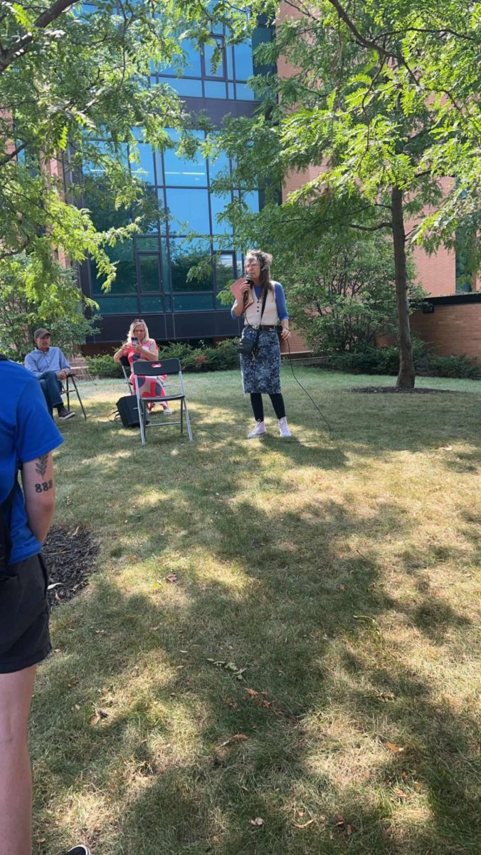 TikTok famous preacher Cindy Smock, who goes by Sister Cindy, speak to students outside of Horizon Village Sept. 11. 