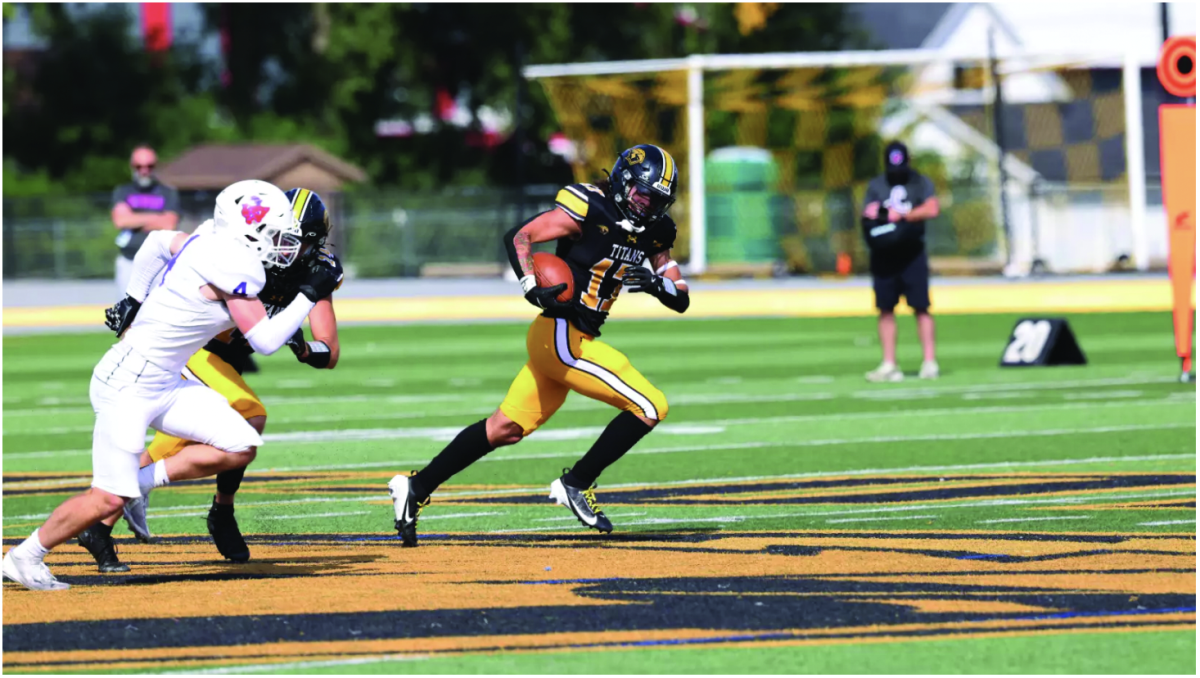 UWO’s Justice Lovelace (17) evades a Linfield defender at J.J. Keller Field at Titan Stadium. 
