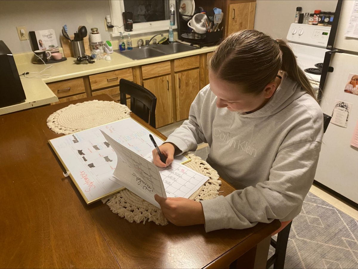 Cassidy Johnson / The Advance-Titan - Antczak does her weekly planning. She has one large calendar for places and dates, and a smaller one for her assignments.
