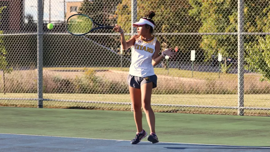 Courtesy of Steve Frommell / UWO Athletics -- Mana Usui volleys the ball over the net in UWO's 7-0 win over Marian Sept. 25.