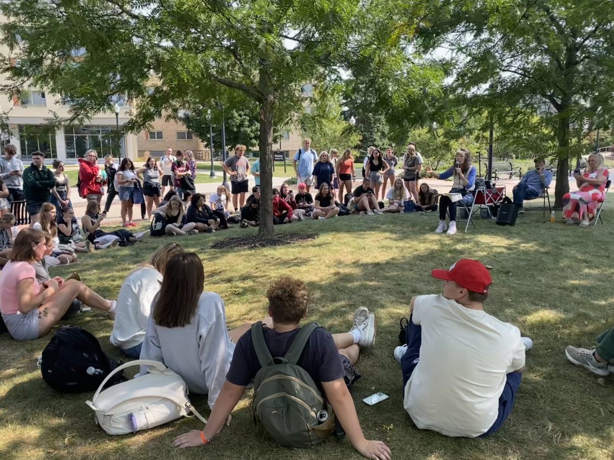 UW Oshkosh students gather behind Horizon Village to hear Christian and internet personality Sister Cindy do her famous "slut shaming."

