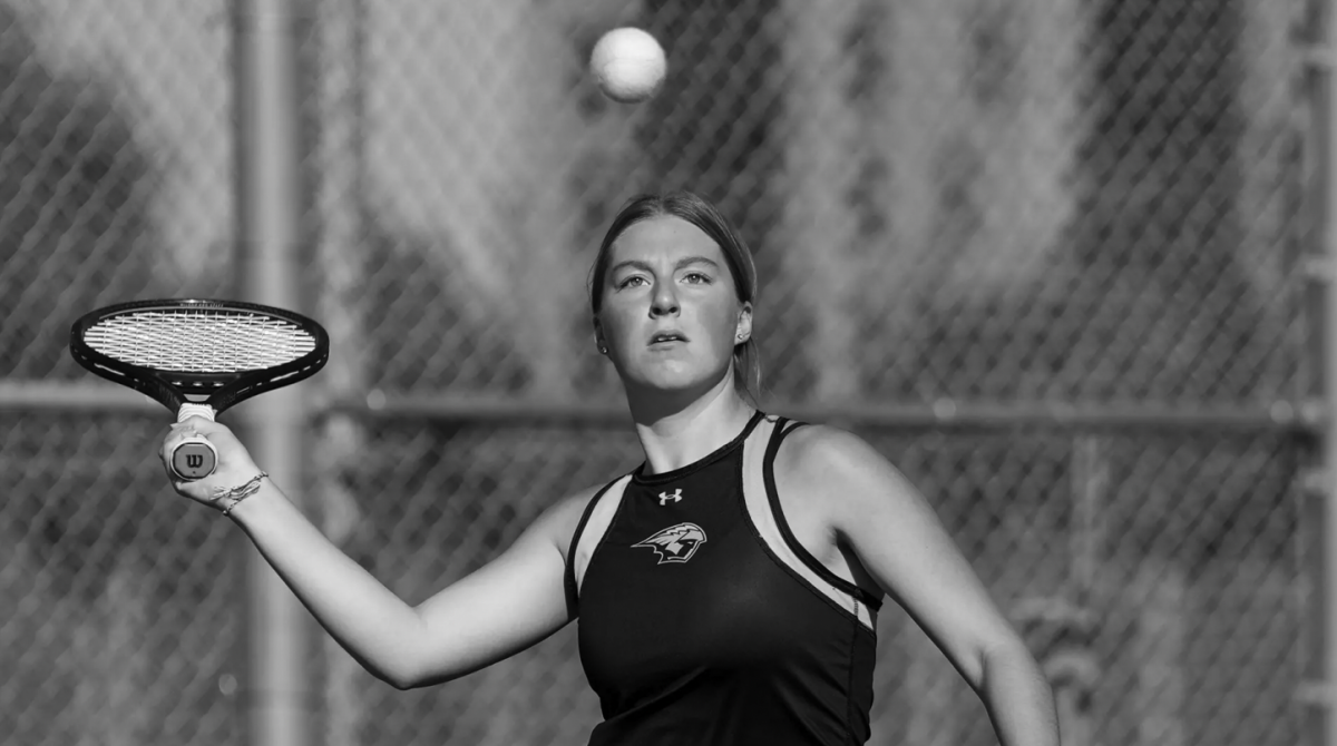 UWO’s Brianna Owens vollies the ball over the net against UW-Whitewater at Kolf Tennis courts.