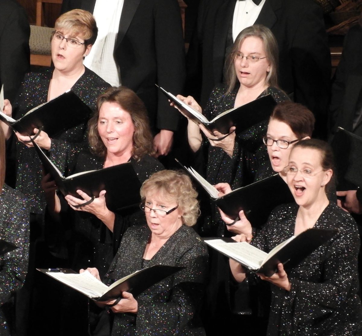 The Oshkosh Chamber Singers perform at a concert earlier this year. Below: Cayla Rosché (Left) and Sean Lynch (Right).