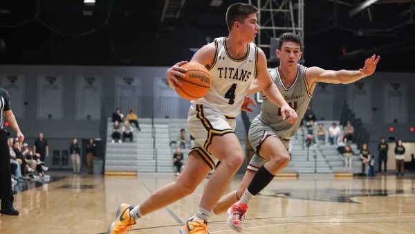 UWO's Michael Metcalf-Grassman (4) dribbles past a UW-La Crosse player during the game vs the Eagles last season. Metcalf-Grassman led the team with 28 points.