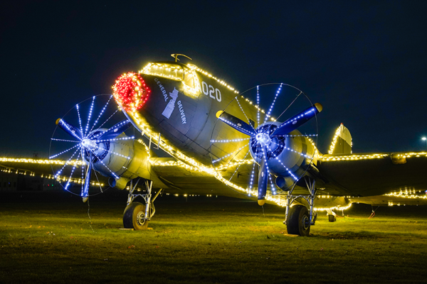 C-47 Skytrain “General Delivery” is decorated for the 2023 Celebration of Lights on the EAA grounds. The 2024 edition of Celebration of Lights is set to return November 29th.