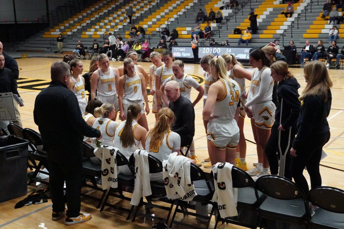 UWO women’s basketball coach Brad Fischer talks with his team during a timeout in the game against Central College (Iowa) on Nov. 22.
