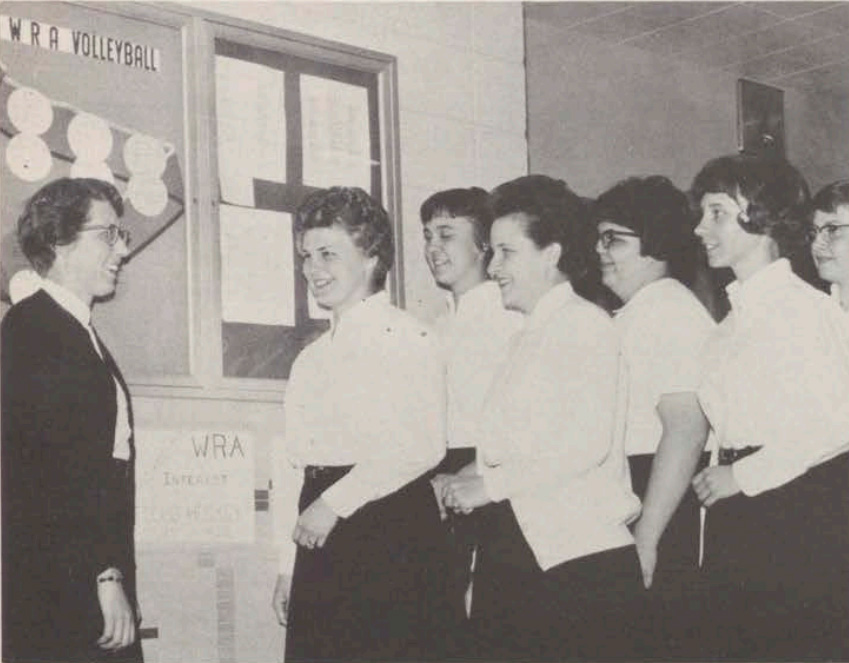 Courtesy of UWO Archives -- Carol Anhalt (left) talks to the UWO Women's Recreation Association in 1965. Anhalt served as the faculty advisor to the club that served as a precursor to women's athletics teams at the university before Title IX was passed in 1972.