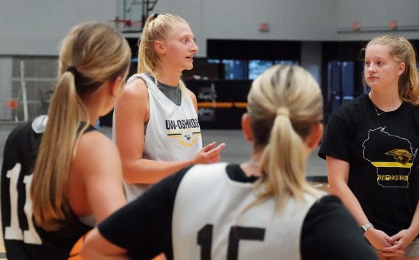 Delaney Ross / Advance-Titan -- UWO captain Kayce Vaile rallies her teammates, including Jaden Kolinski, with words of motivation, inspiring everyone to push toward their goals.