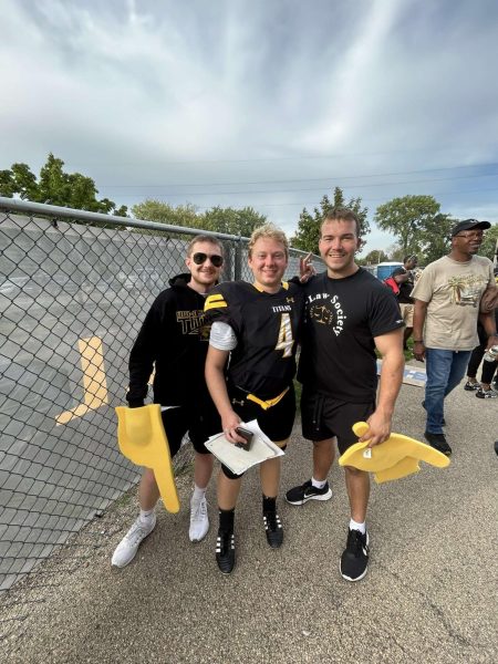 Katie Pulvermacher / Advance-Titan -- Staff writer and former Co-Sports Editor Nolan Swenson (right) celebrates a UW Oshkosh football victory with Assistant News Editor Jacob Link (middle) and News Editor Josh Lehner (left).