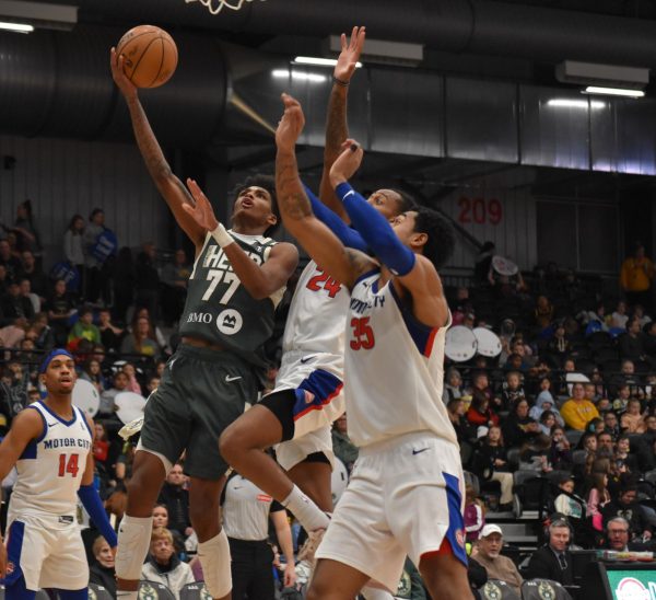 Jacob Link / Advance-Titan -- The Herd's AJ Johnson drives to the rim in Wisconsin's 94-88 victory over the Motor City Cruise Thursday at the Oshkosh Arena.