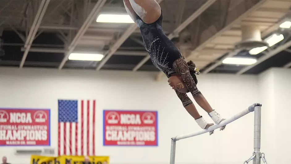 Courtesy of Terri Cole / UWO Athletics -- Reanna McGibboney swings her way to a first-place finish on the uneven bars.