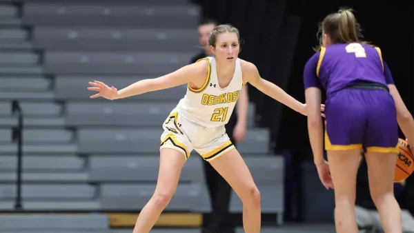 Courtesy of Steve Frommell / UWO Athletics -- Oshkosh's Avery Poole defends a Stevens Point player in a game earlier this season at the Kolf Sports Center.