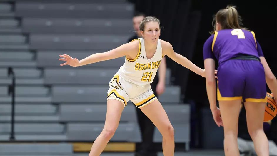 Courtesy of Steve Frommell / UWO Athletics -- Oshkosh's Avery Poole defends a Stevens Point player in a game earlier this season at the Kolf Sports Center.