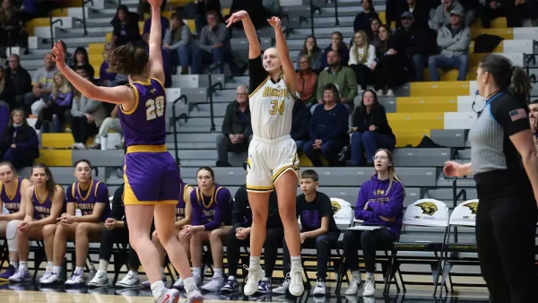 Courtesy of Steve Frommell / UWO Athletics -- Oshkosh's Kayce Vaile puts up a 3-pointer against UW-Stevens Point in a game earlier this season at the Kolf Sports Center.