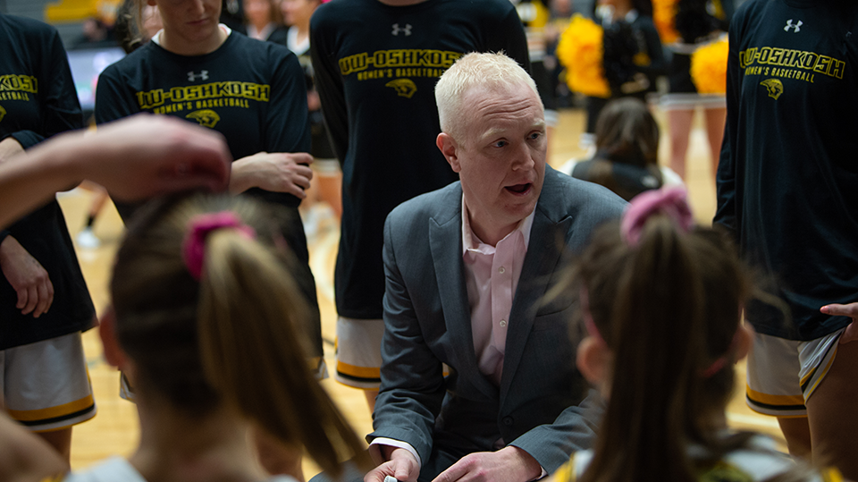 Courtesy of Liz Smith -- UWO head coach Brad Fischer talks with his team during a game in the 2020-21 season.