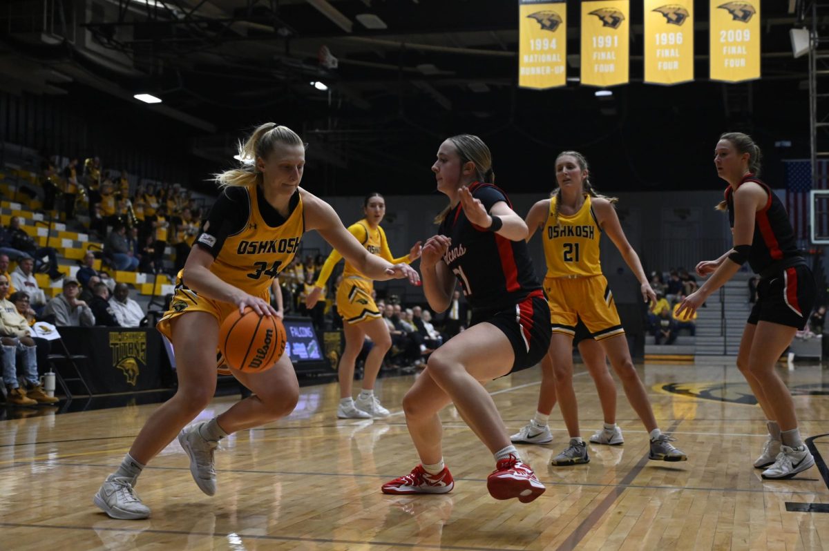 Jess Duch / Advance-Titan -- UWO's Kayce Vaile tries to get around a UWRF defender in the game against the Falcons Feb. 8 at the Kolf Sports Center.