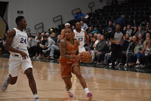 Jacob Link / Advance-Titan -- The Herd's James Akinjo drives to the basket in a game earlier this season at the Oshkosh Arena.