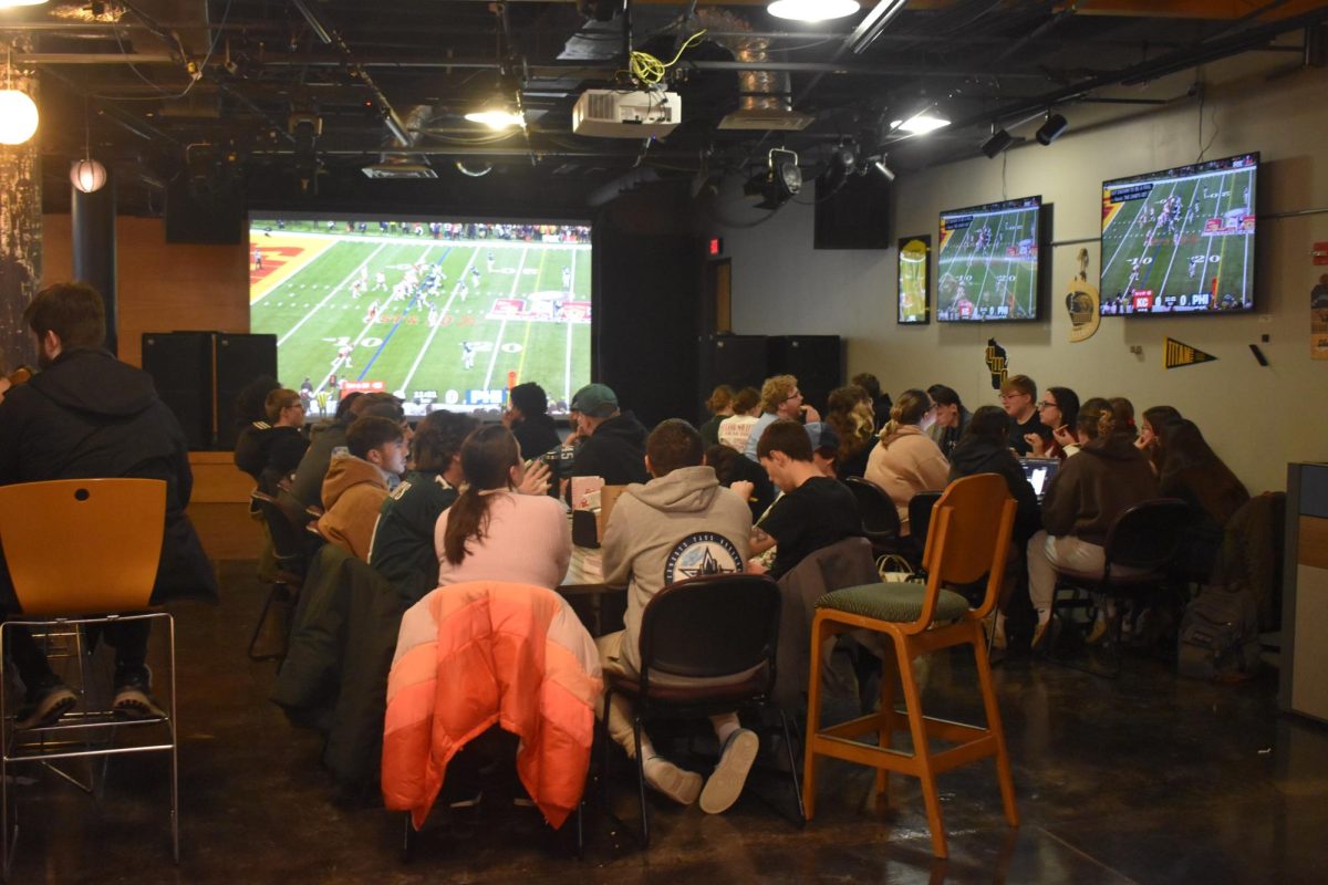 Cassidy Johnson / Advance-Titan -- Students pack into Titan Underground to watch the Super Bowl last Sunday.