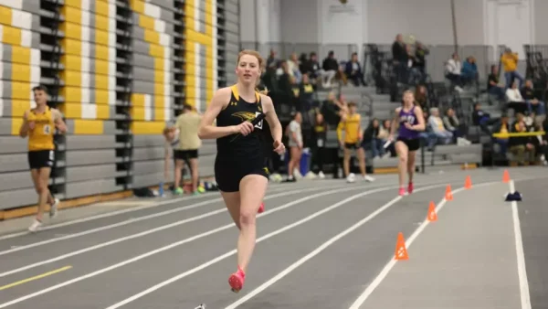 Courtesy of Steve Frommell / UWO Athletics -- Oshkosh's Cyna Madigan runs in an event earlier this season at the Kolf Sports Center.