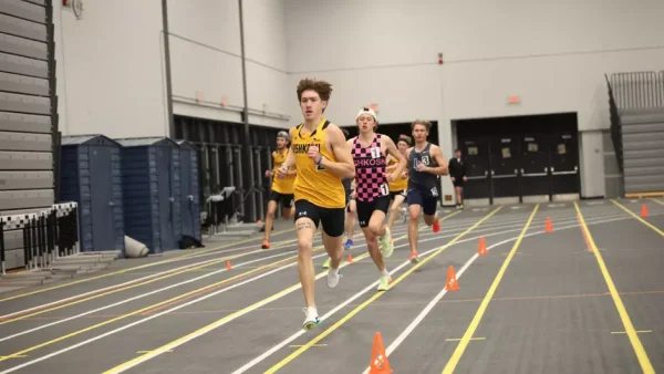 Courtesy of Steve Frommell / Advance-Titan -- Lucas Nicholson runs the mile in a meet earlier this season at the Kolf Sports Center.