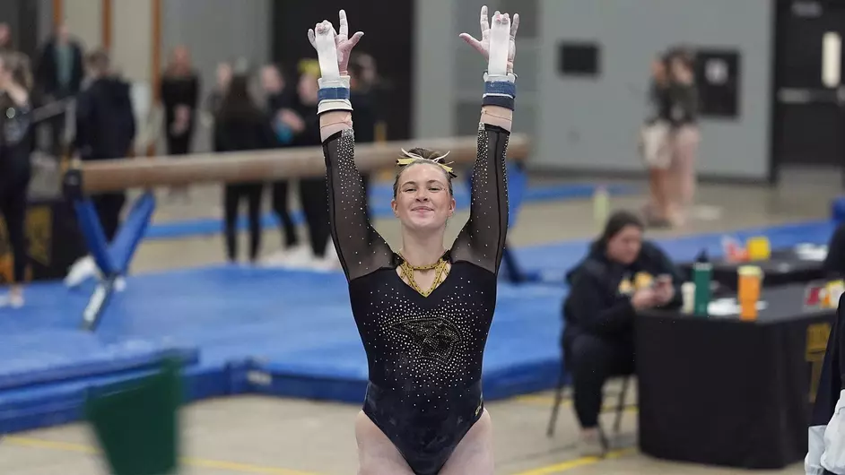 Courtesy of Terri Cole / UWO Athletics -- UWO's Zoe Krull dismounts from the uneven bars in a meet earlier this season at the Kolf Sports Center.
