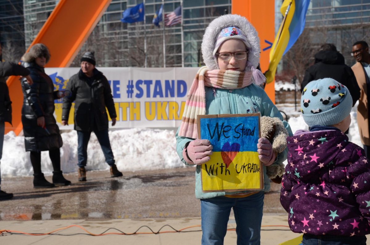 Vladyslav Plyaka / Advance-Titan -- A child holds a sign in support of Ukraine at a rally held hosted by Wisconsin Ukrainians, Inc., in Milwaukee Feb. 23 in the wake of the third year of the Russian invasion.