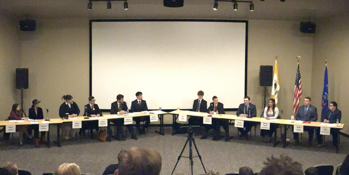 Josh Lehner / Advance-Titan -- OSG candidates (from left to right) Nora Reljic, Athena Dedow, Aspyn Rafac, Elijah Plonsky, Marco Marchiando, Bryce Rataczak, Eli Finn, Grant Luedtke, Jesse Ramsey, Sandy Yanez Velasquez, Matt Caine and Alex Coleman debate topics such as transparency, communication, student involvement and mental health.