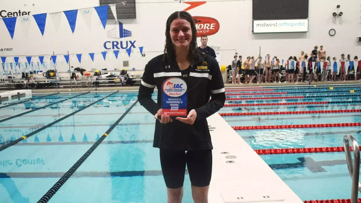 Courtesy of UWO Athletics -- Oshkosh's Francesca Schiro poses with the Swimmer of the Meet trophy at the 2025 WIAC Swimming and Diving Championships.