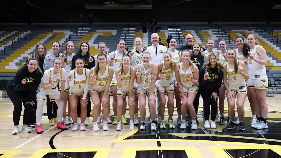 Courtesy of Steve Frommell / UWO Athletics -- The UWO women's basketball team celebrates after cutting down the nets at the Kolf Sports Center following a 64-42 win over UW-Eau Claire last Wednesday. 