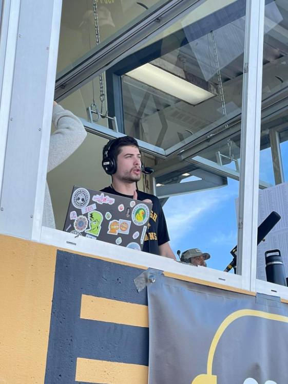 Dylan Eckhart / Advance-Titan --Co-Sports Editor Dylan Eckhart calls a football game for WRST-FM last year.