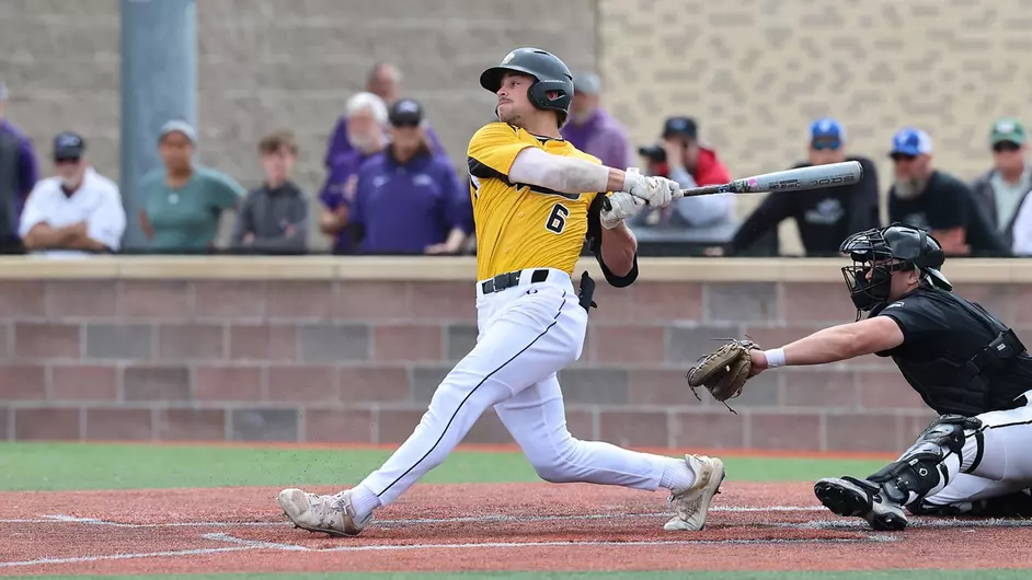 Courtesy of Steve Frommell / UWO Athletics -- UWO's Logan Schill swings the bat in Oshkosh's 5-2 victory over UW-Whitewater in game two of the NCAA Division III Super Regional at Prucha Field.