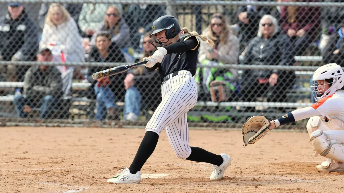 Courtesy of Steve Frommell / UWO Athletics -- Haylie Wittman swings the bat in a game earlier this season at UW-Oshkosh Softball Park.